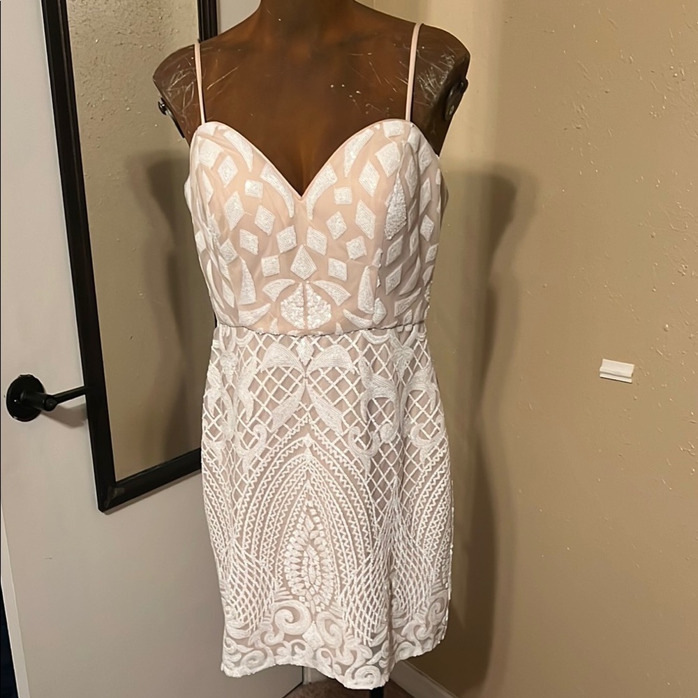 Stunning nude and white dress with adjustable straps.